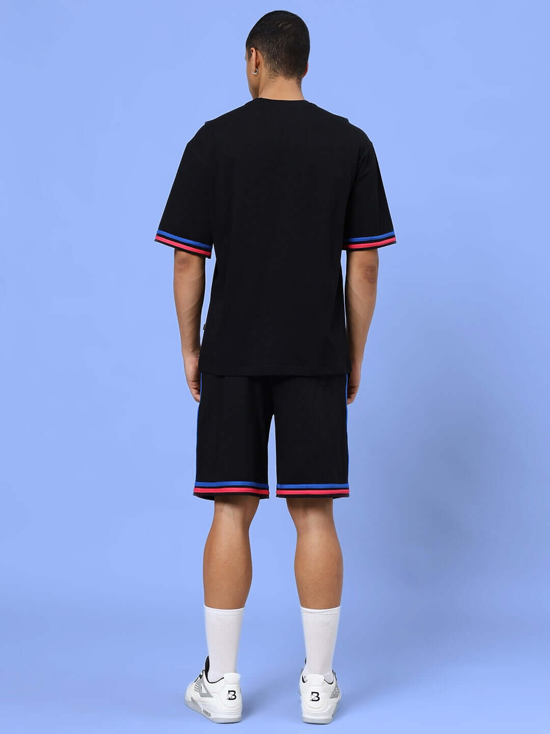 Back view of MIAMI COLOR BLOCK CO-ORD SET BLACK featuring a trendy top and matching shorts with color accents.