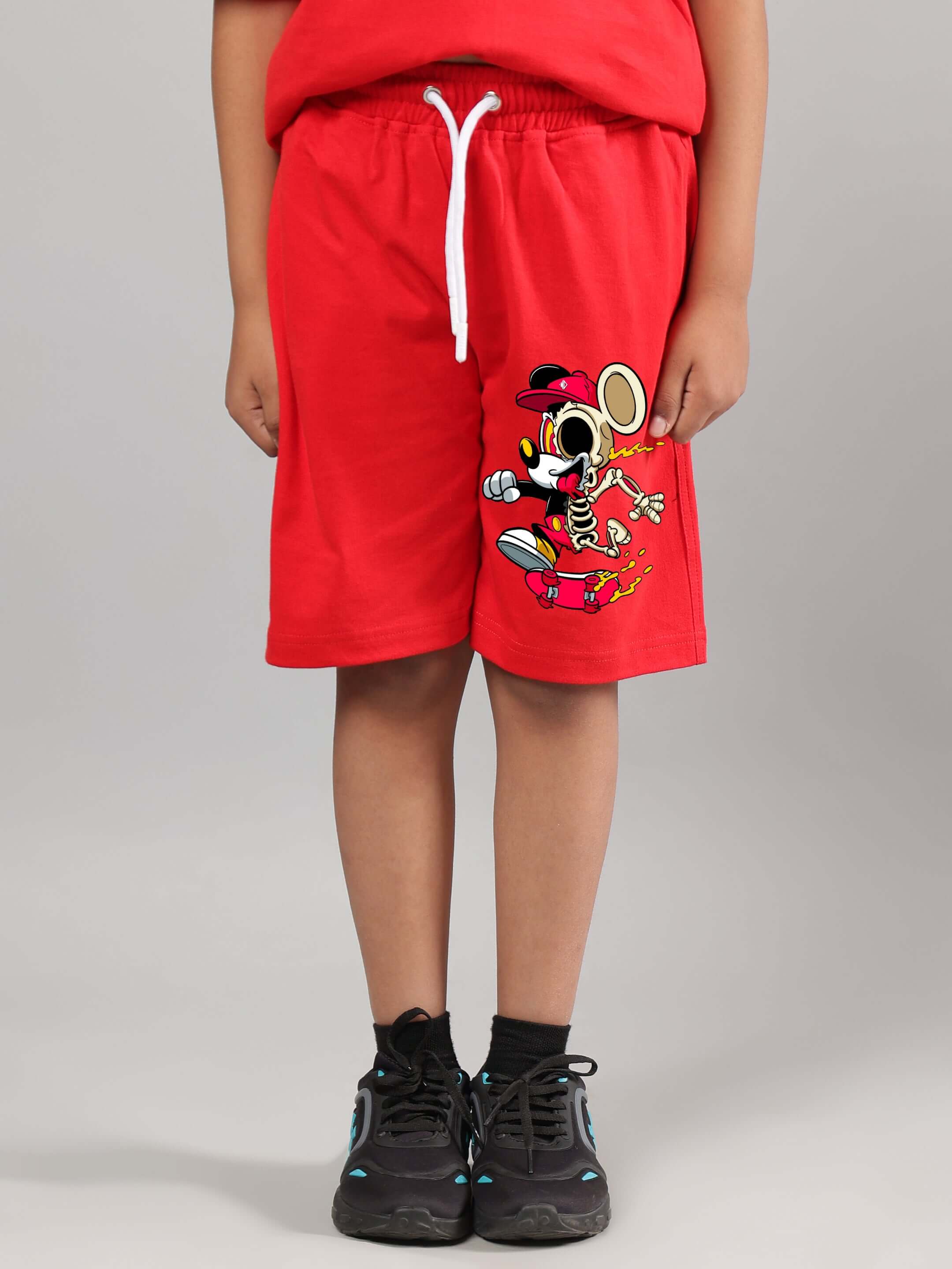 Child wearing MICKEY SUMMER CO-ORD FOR BOYS GIRLS RED featuring Mickey Mouse print on red shorts, showcasing Disney style and comfort.