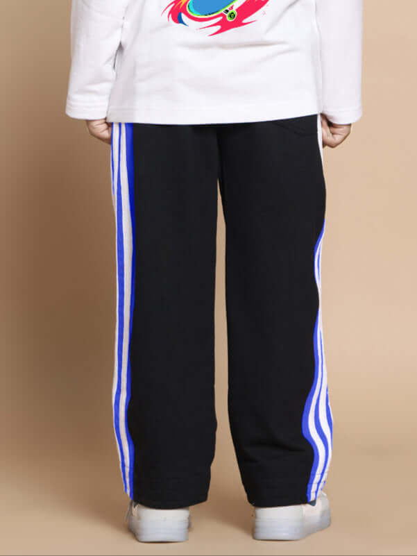 Child wearing Milano Relaxed Pant Joggers in black and blue with striped sides, back view.