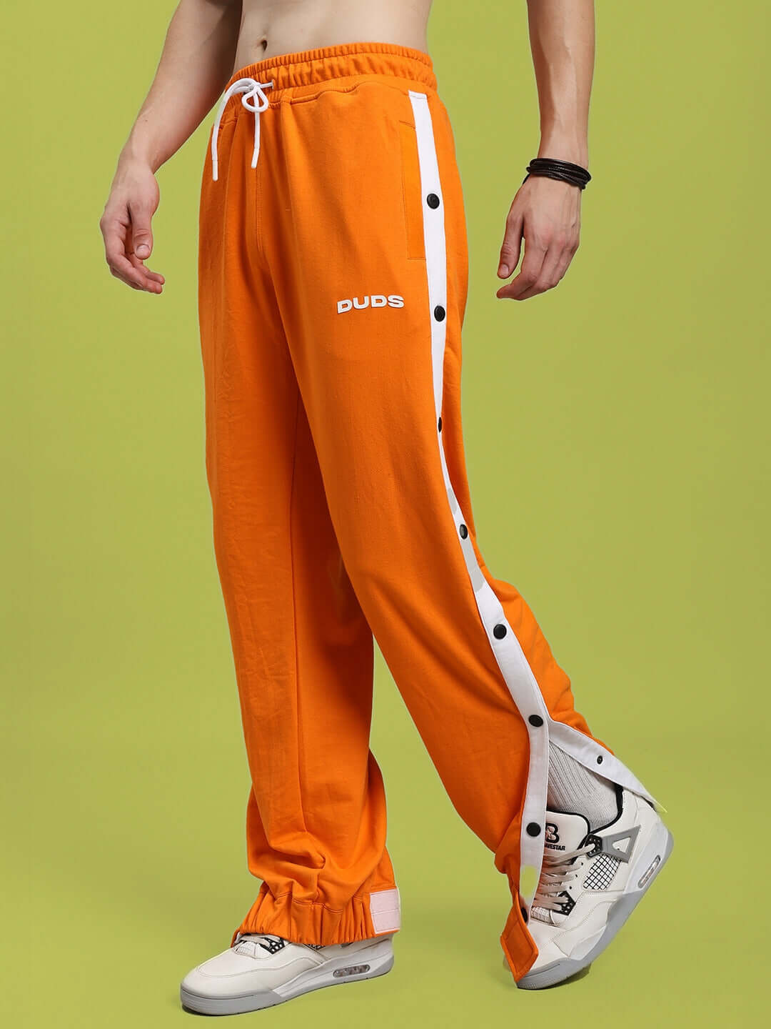 MILLER RELAXED FIT JOGGERS ORANGE with sporty side stripes, comfortable casual wear.