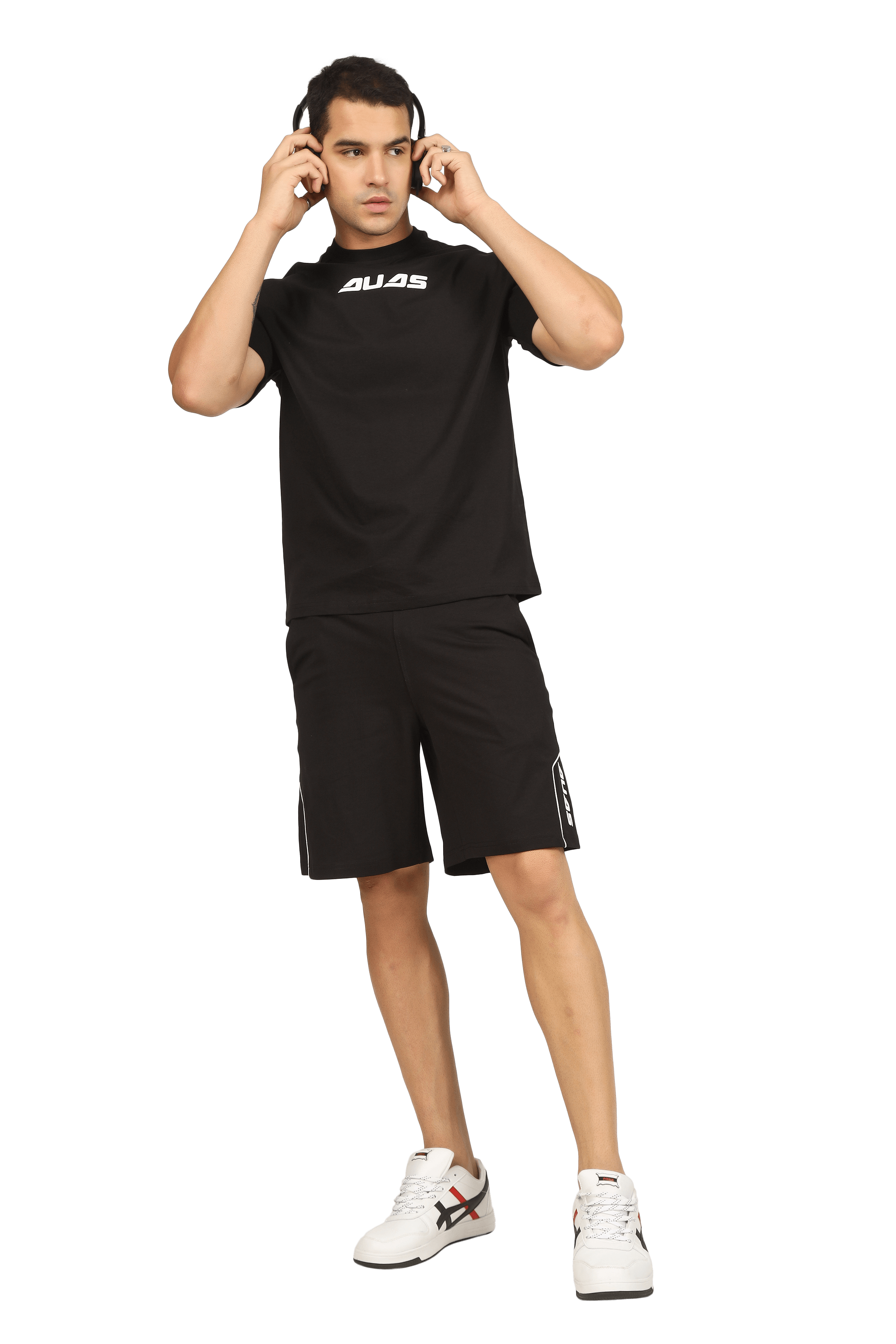 Man wearing a black MINIMAL SHAPED CORD CO-ORD SET with a t-shirt and shorts, stylish and comfortable for everyday wear.