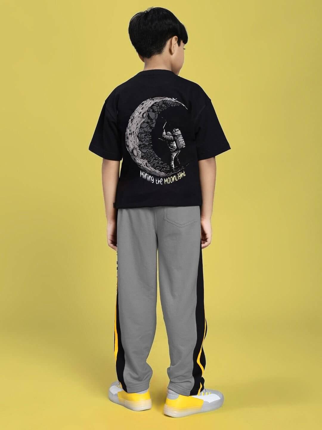 MINING THE MOONLIGHT PRINT CO-ORD FOR BOYS GIRLS BLACK GREY outfit featuring a black t-shirt with a moon graphic and grey pants.