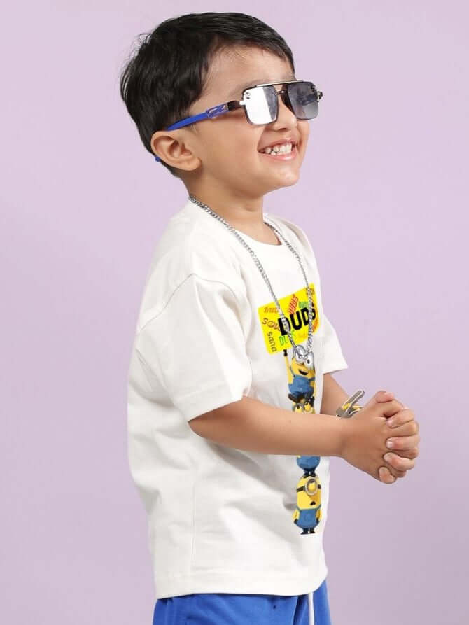Smiling child wearing MINION CARTOON T-SHIRT FOR BOYS AND GIRLS OFF WHITE with sunglasses