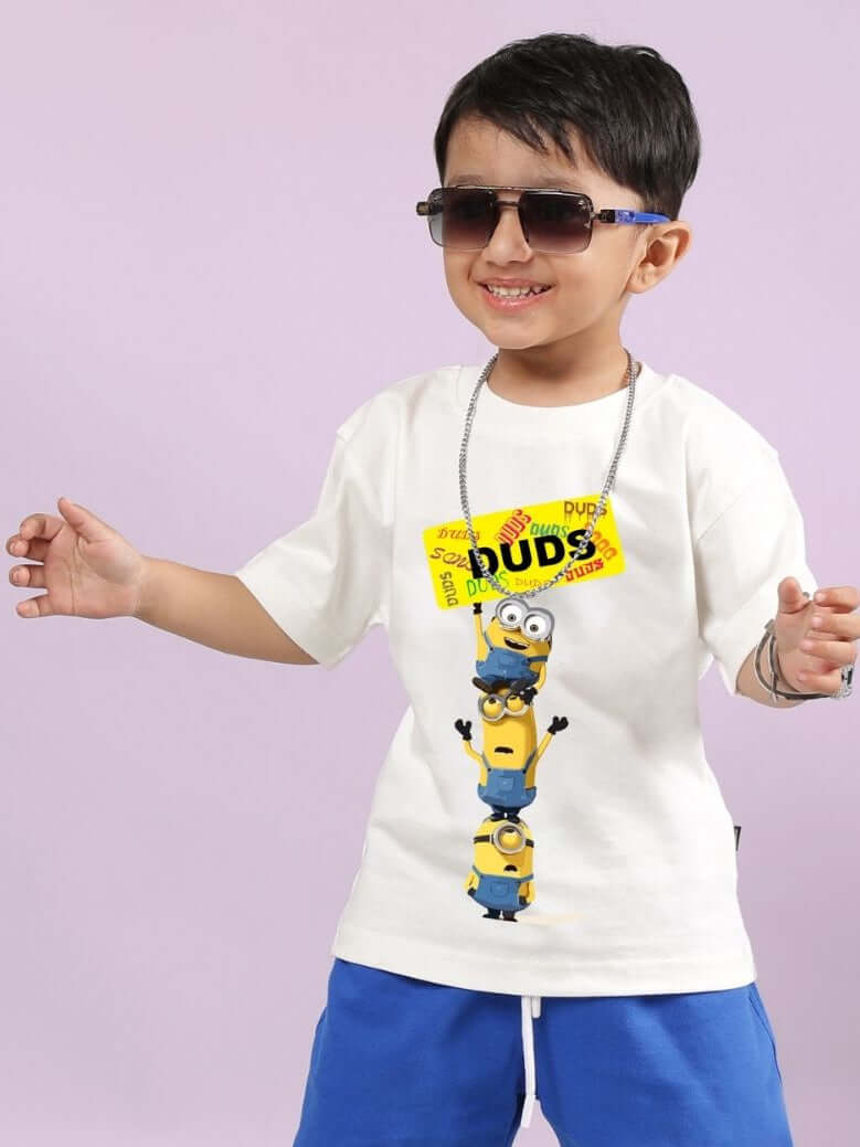 Child wearing Minion Cartoon T-Shirt for Boys and Girls Off White, smiling with sunglasses.