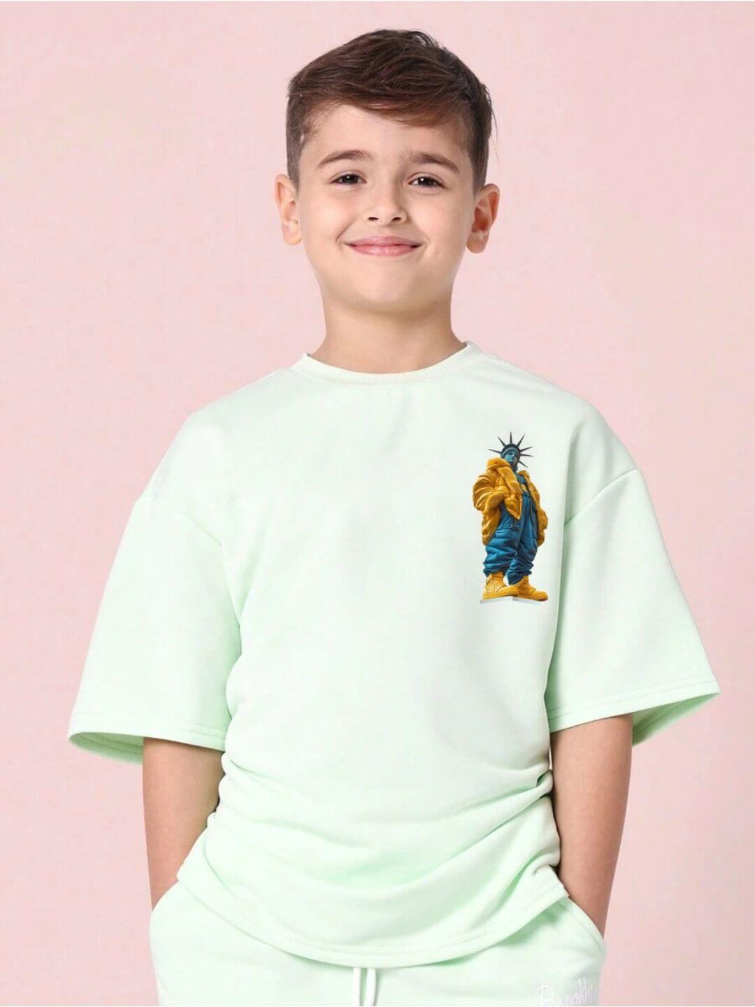 Boy wearing STATUE OF LIBERTY CO-ORD SET FOR BOYS AND GIRLS MINT GREEN with printed statue graphic.