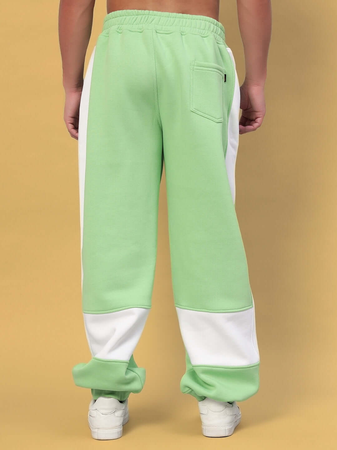 Rear view of MINTED BLISS FLEECE COLORBLOCK CARGO PANT GREEN WHITE, featuring bold green and white design, perfect for streetwear.