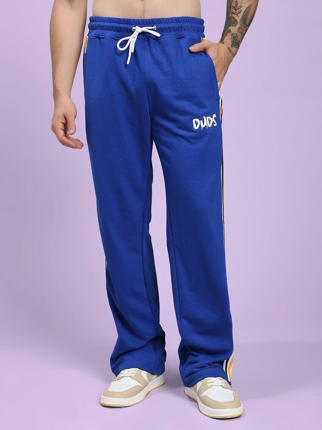 Person wearing Modern Edge Multi-Stripe Co-ord Set Royal Blue with side stripes, featuring comfort and retro design for sporty style.