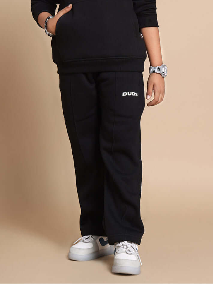 Black Molly jogger pants for boys and girls, featuring a comfortable design by DUDS, perfect for casual wear.