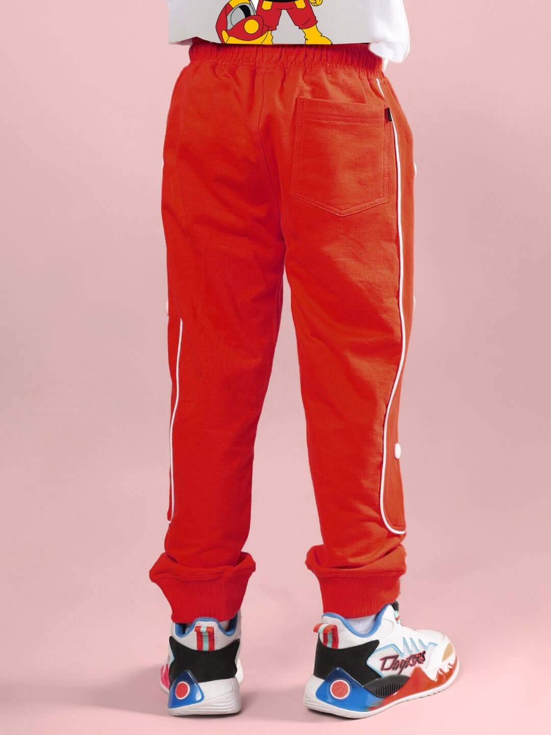 Child wearing MOON NIGHT JOGGER FOR BOYS & GIRLS RED by WEAR DUDS, showcasing cozy and trendy design for active kids.