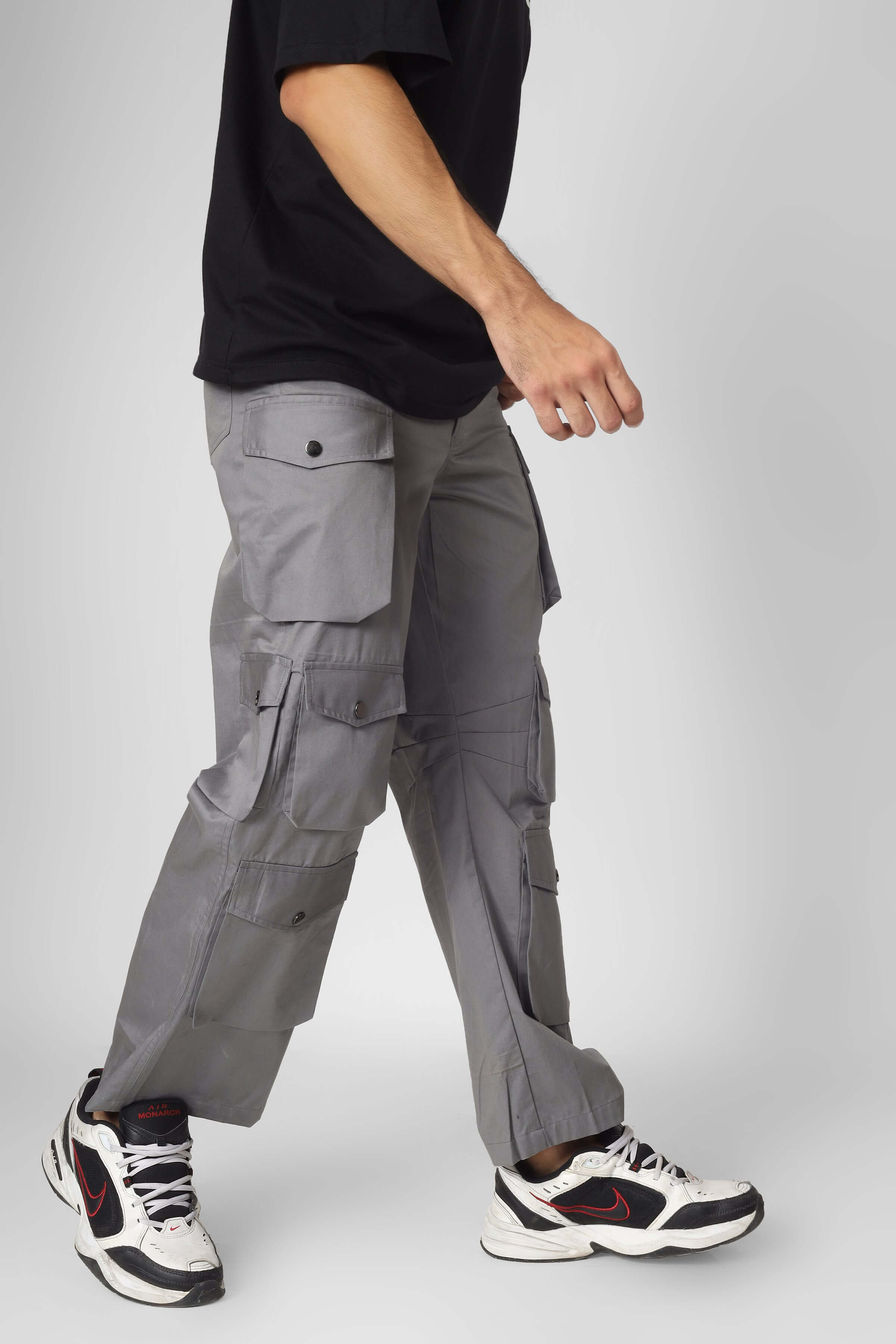 Model wearing Moon Stone Cargo Pants with 12 cargo pockets, showcasing modern street style fashion.
