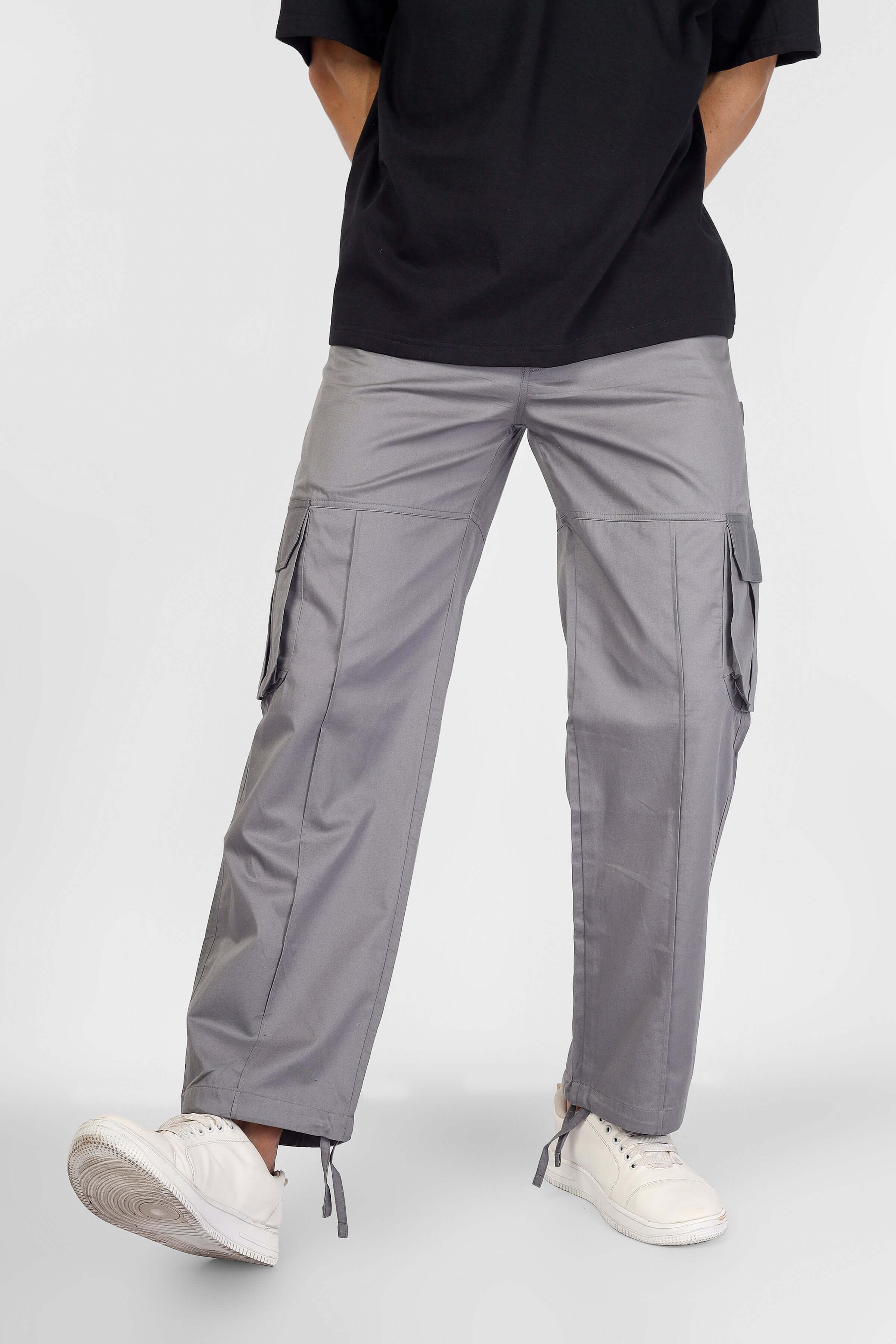 Person wearing Moon Stone cargo pants with 6 pockets, customizable fit, made by DUDS, designed for style and comfort.
