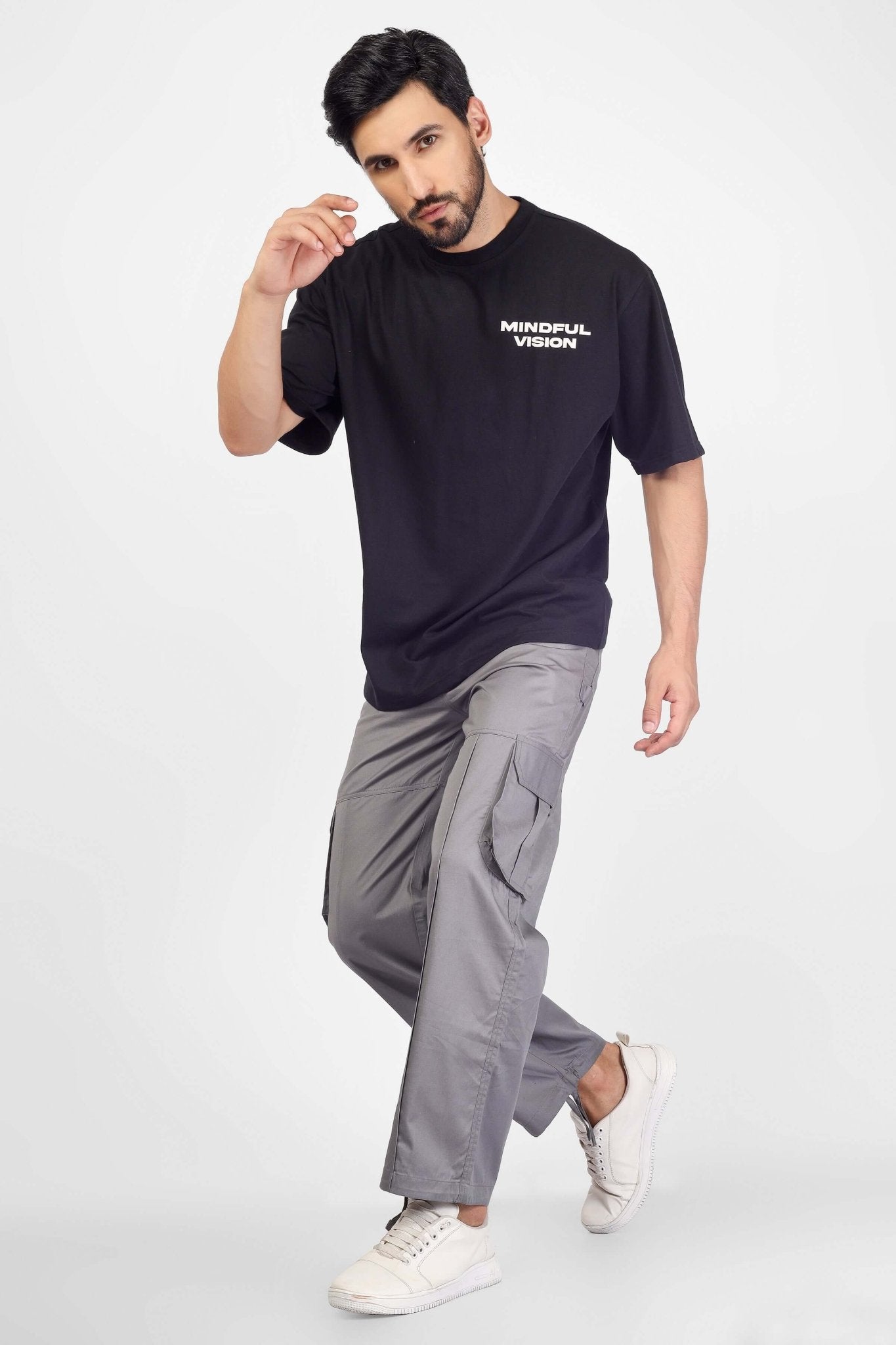 Man wearing moon stone cargo pants with 6 cargo pocket in urban style.