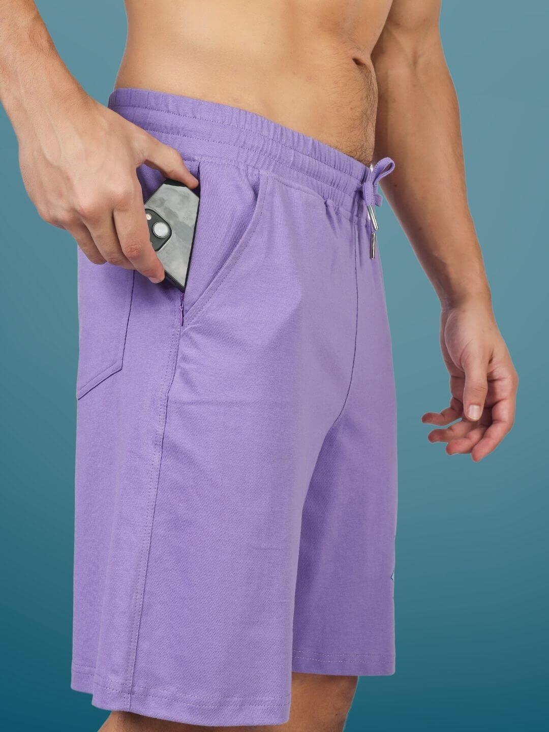 Man wearing Morty-fied Regular Fit Lavender Shorts showing pocket storage.