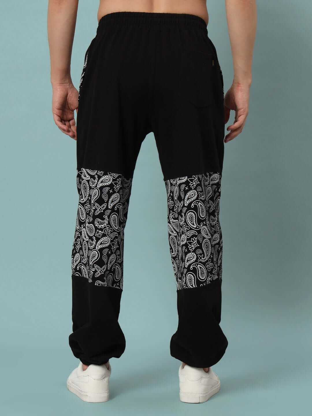 Back view of MOSAIC BAGGY JOGGERS in black, featuring patterned leg detail, designed by DUDS.