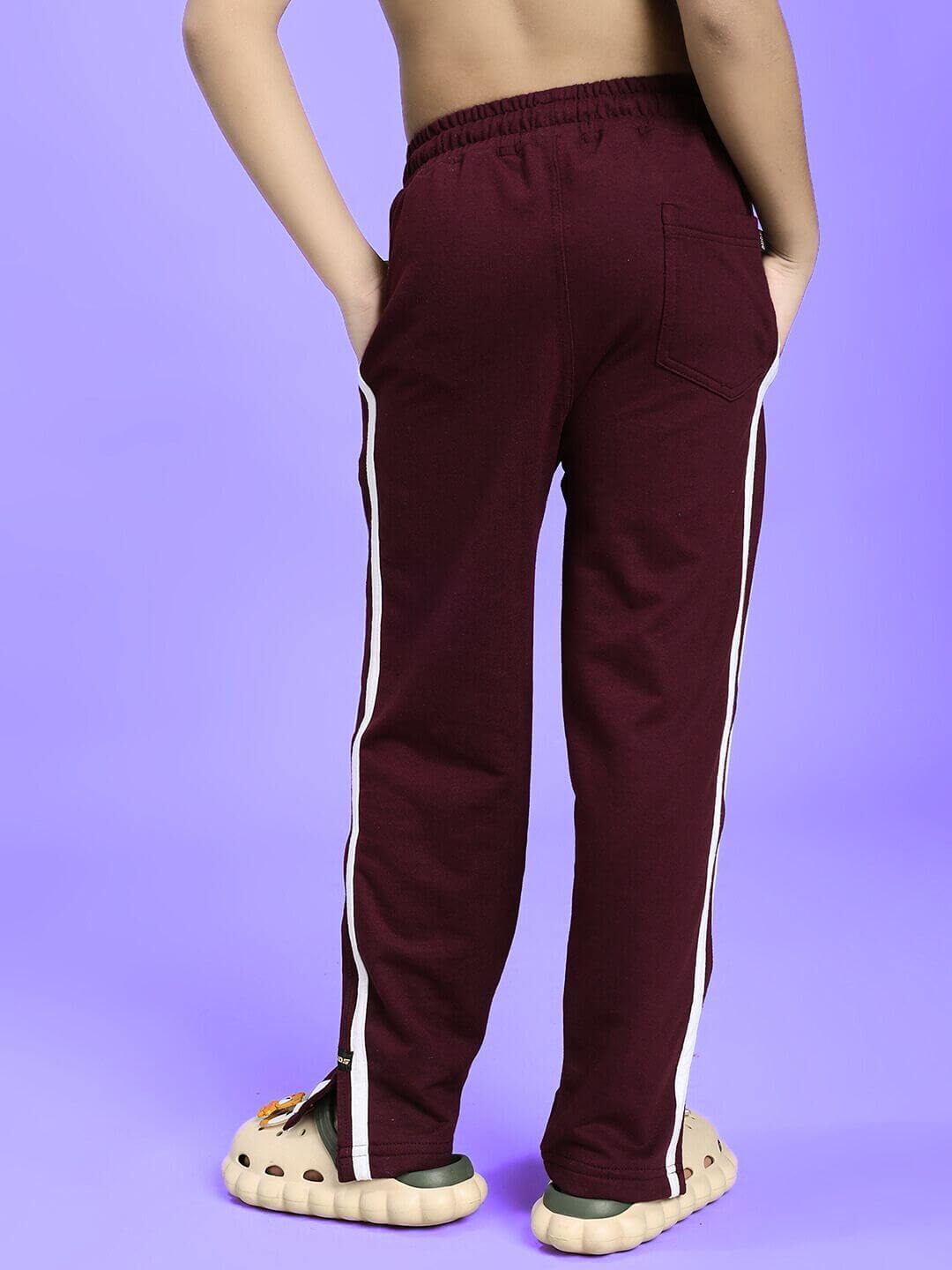 MOSCOW RELAXED FIT JOGGER FOR BOYS AND GIRLS MAROON with white side stripes shown from back view against purple background