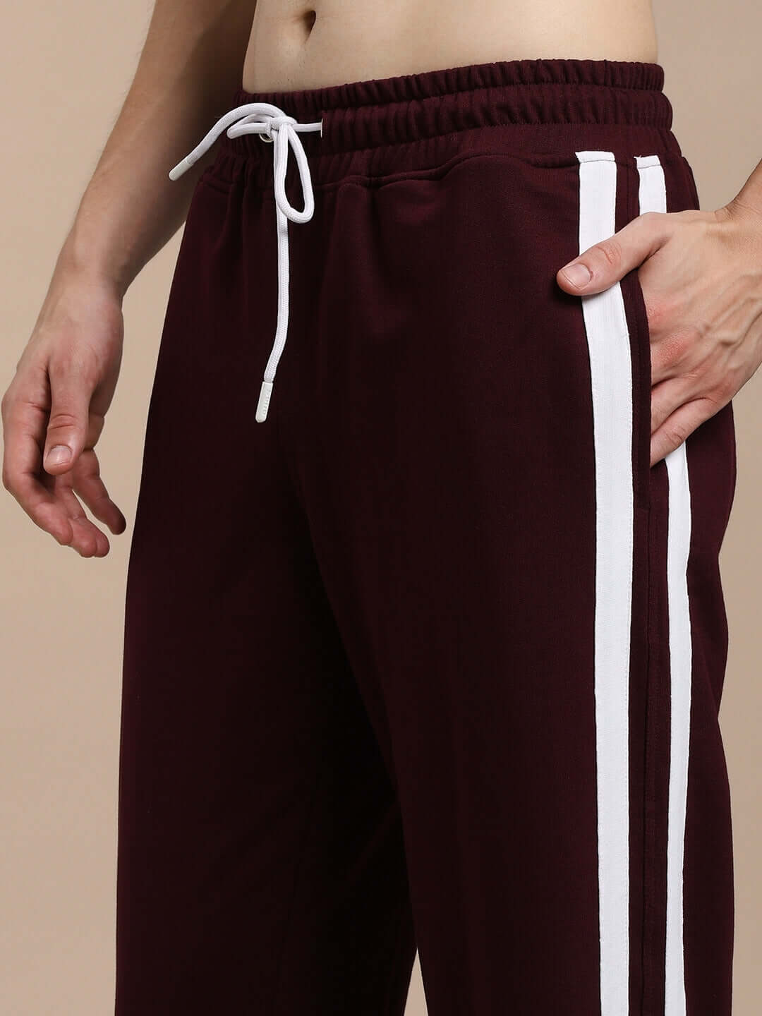 MOSCOW RELAXED FIT JOGGERS MAROON with white side stripes and drawstring waist, close-up view