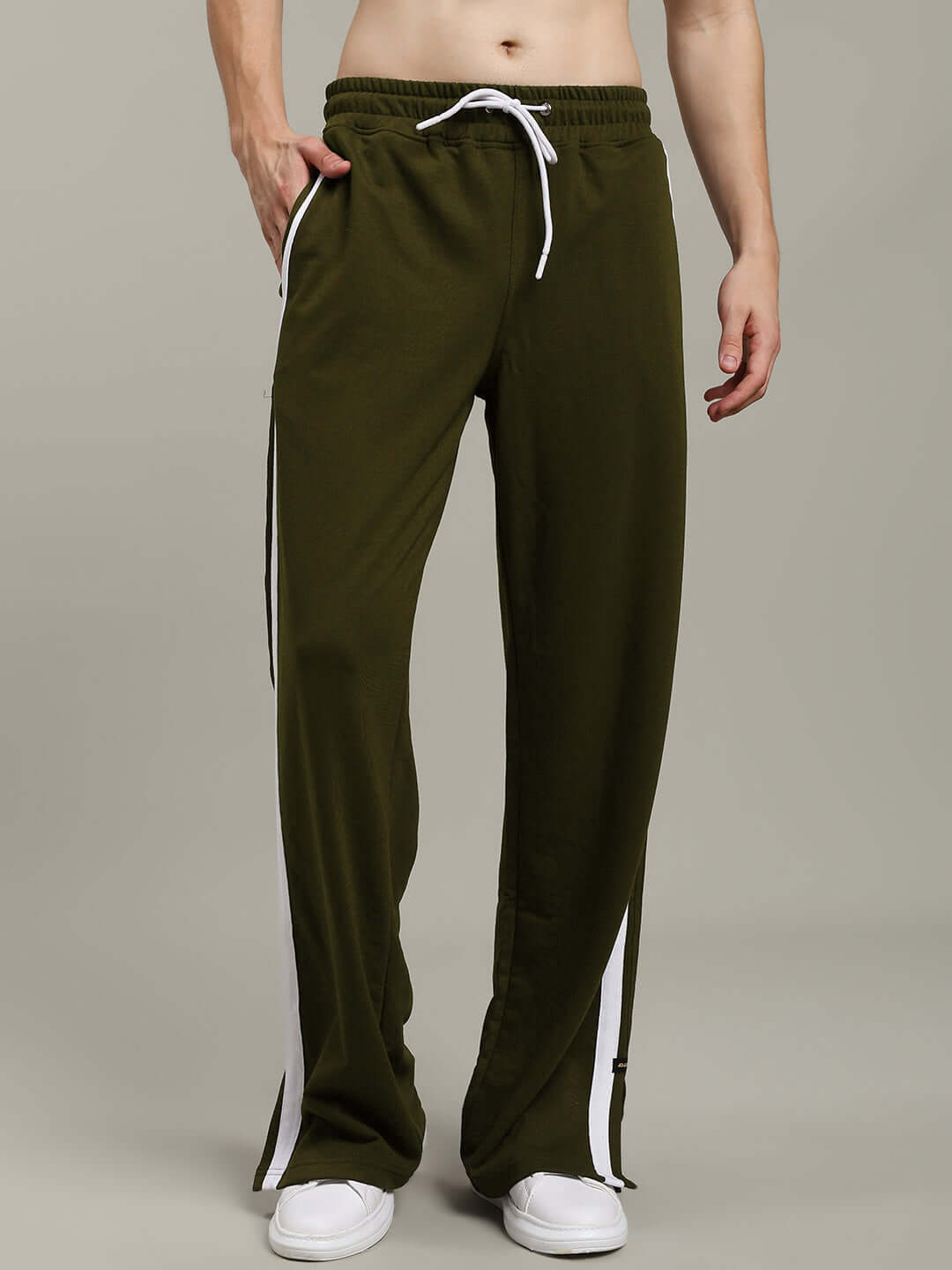 MOSCOW RELAXED FIT JOGGERS OLIVE GREEN for athleisure, shown with white shoes, highlighting relaxed fit and style.