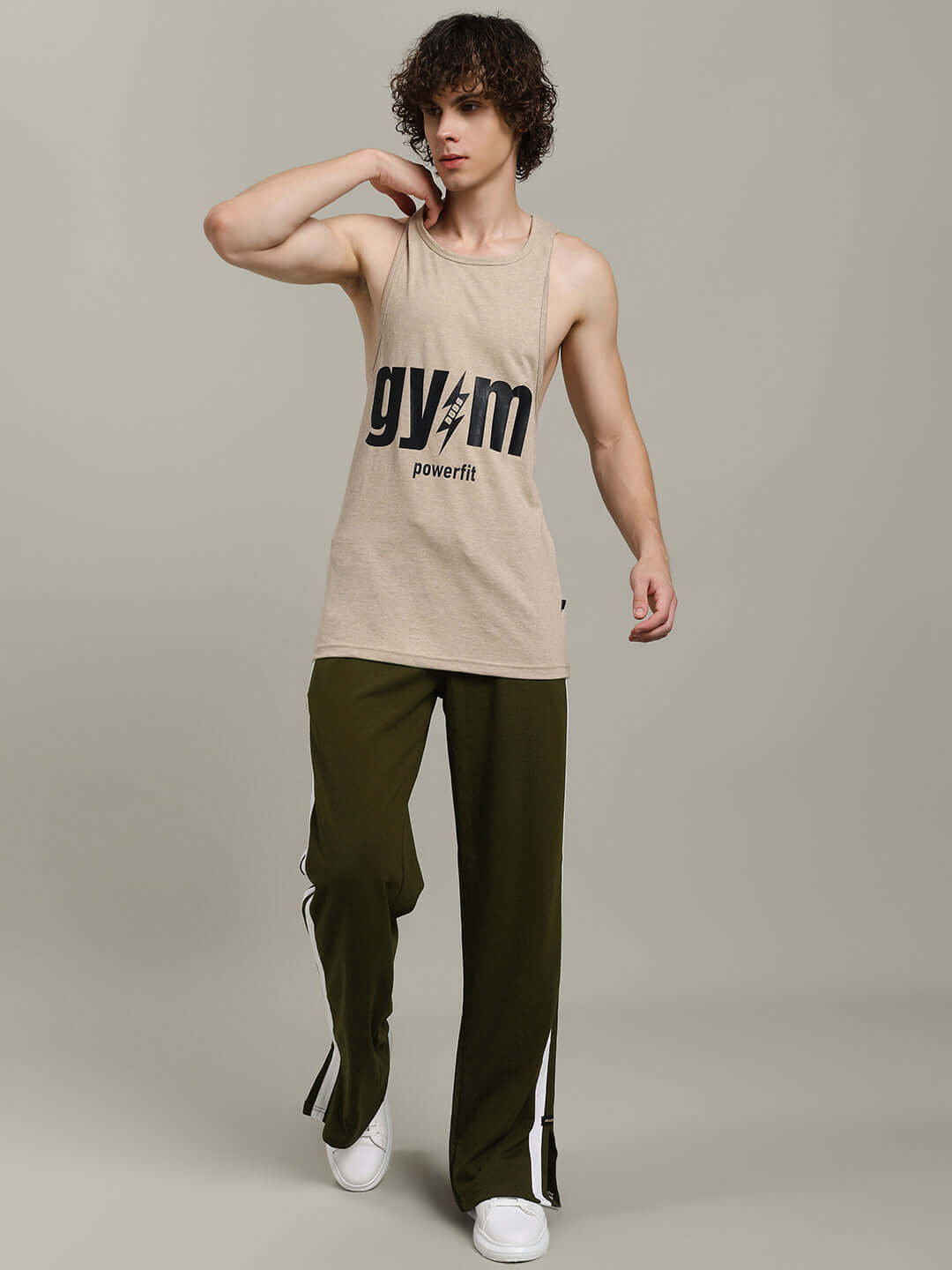 Model wearing MOSCOW RELAXED FIT JOGGERS OLIVE GREEN showcasing athleisure fashion