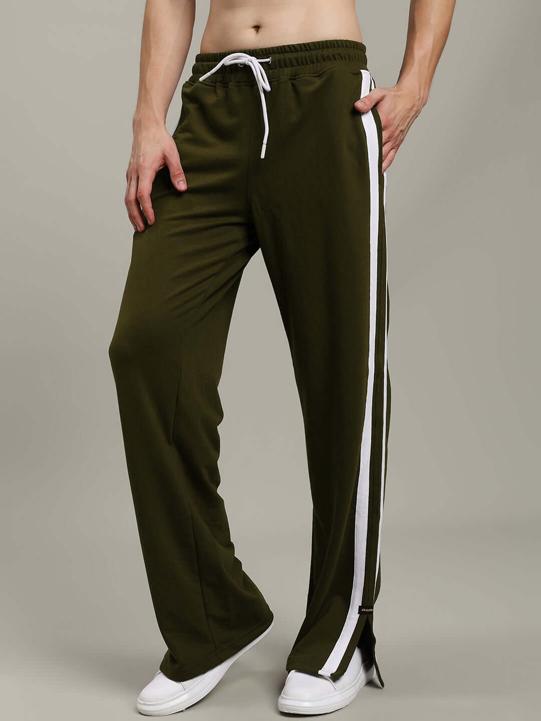 MOSCOW RELAXED FIT JOGGERS OLIVE GREEN on person showcasing comfort and style, with white stripes for a trendy look.