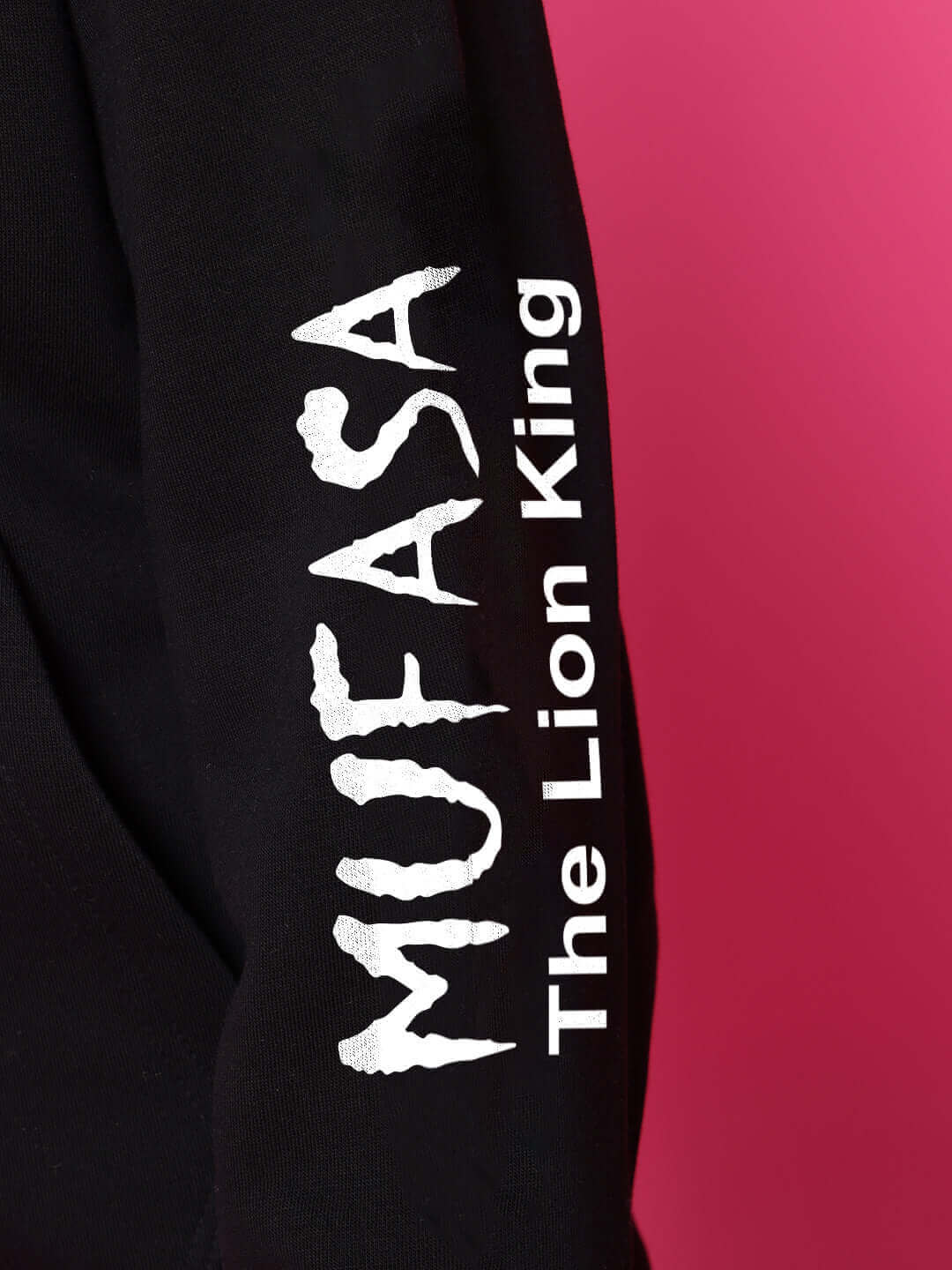 MUFASA FLEECE CO-ORD FOR BOYS GIRLS BLACK sleeve detail with Lion King text on black fabric.