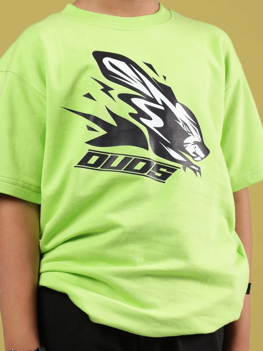 MUFFIN CO-ORD FOR BOYS & GIRLS NEON GREEN-BLACK with rabbit print by DUDS, front view of child wearing vibrant neon green t-shirt.
