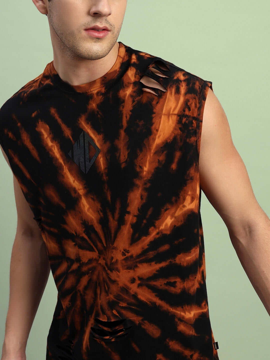 Model wearing a black ripped tie-dye muscle tee from a co-ord set, made of premium cotton French Terry Lycra, showcasing bold design.