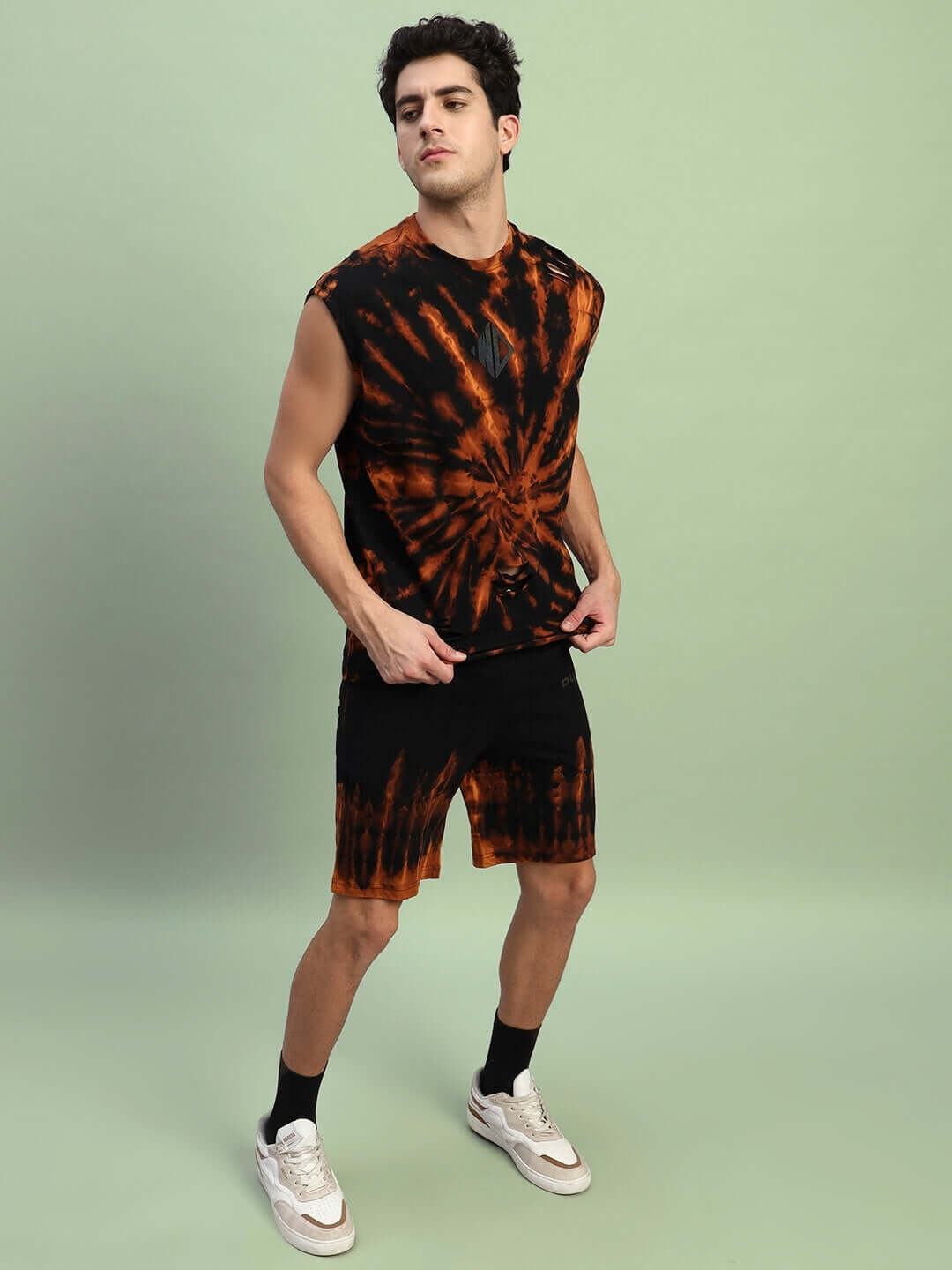 Man wearing black tie-dye muscle tee and shorts co-ord set, featuring premium cotton French terry and elastane fabric.