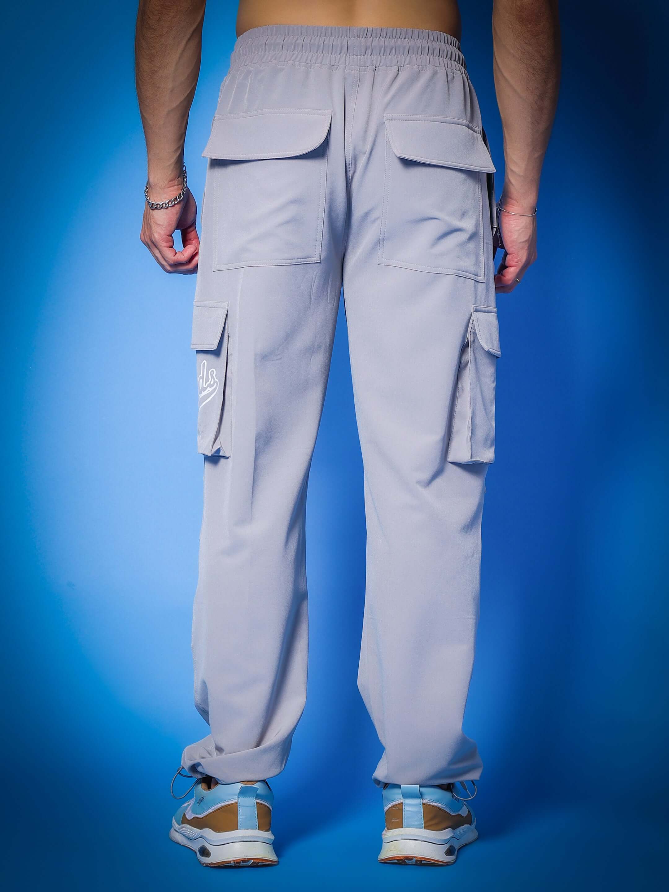 Back view of grey MYRIAD Relaxed Fit Cargo Pants showcasing multiple pockets and comfortable fit, ideal for custom size options.