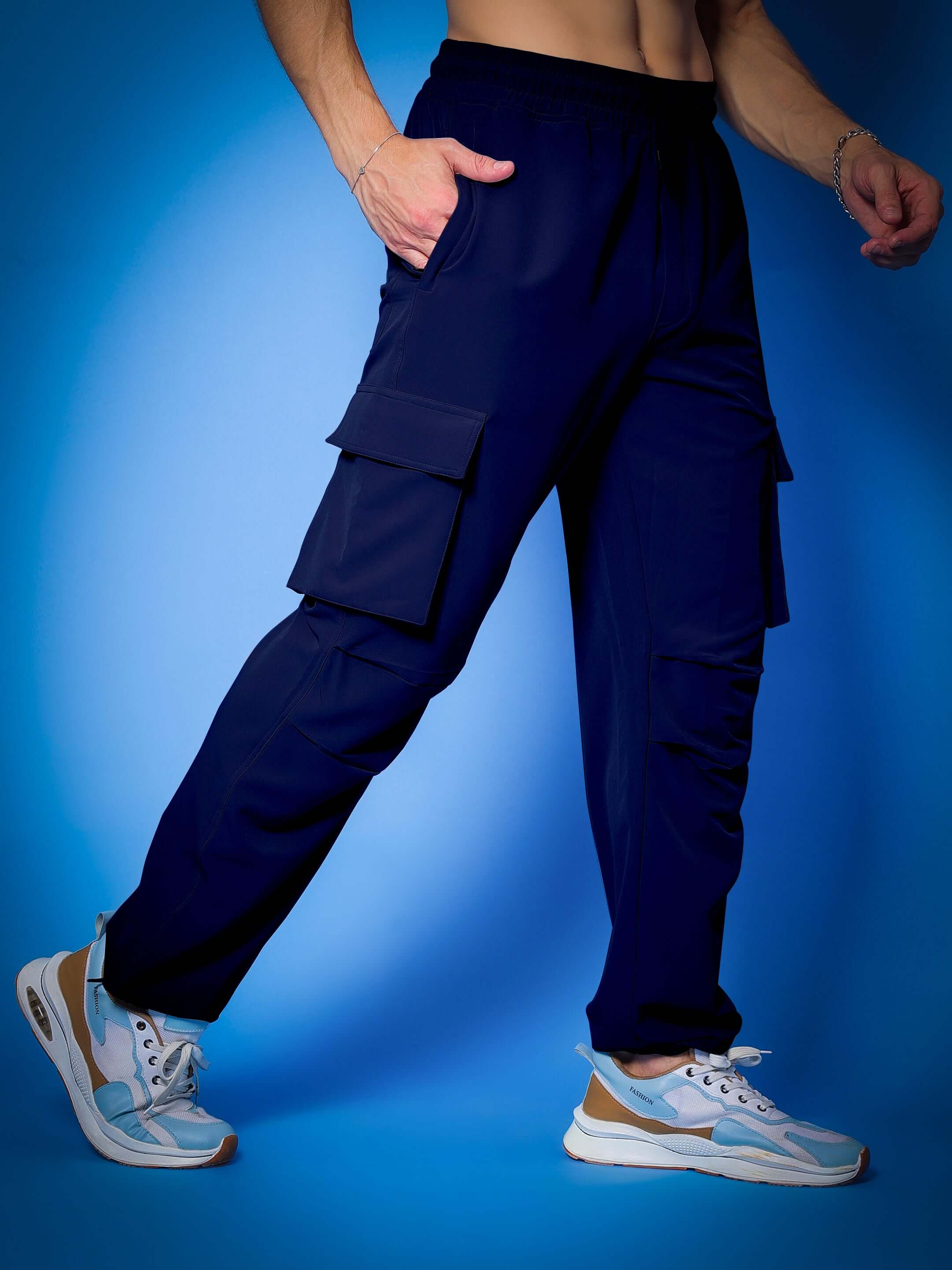 Person wearing MYRIAD RELAXED FIT CARGO PANTS NAVY BLUE showcasing relaxed fit and multiple pockets.