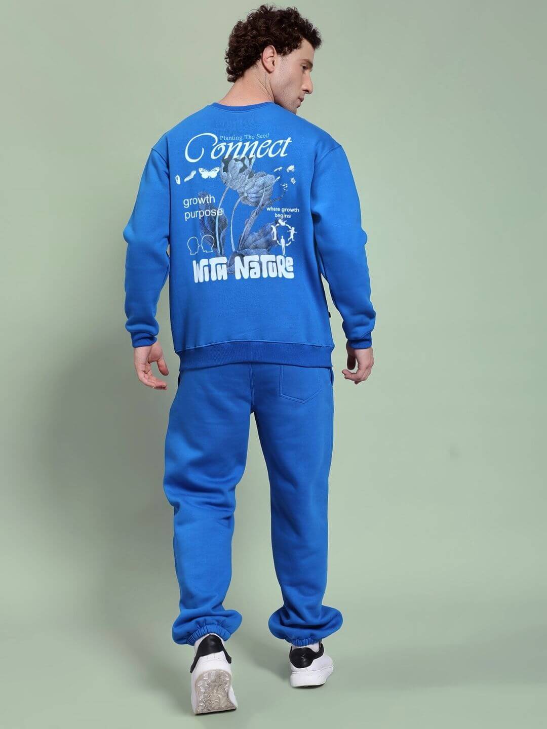 Back view of NATURE LINK FLEECE CO-ORD SET ROYAL BLUE with nature-inspired graphics on sweatshirt.