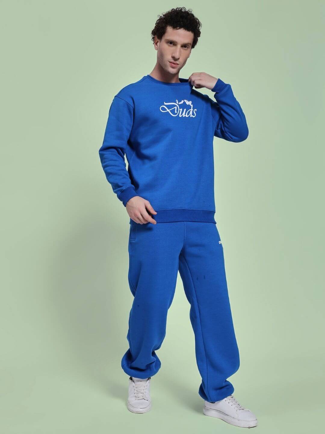 Model wearing NATURE LINK FLEECE CO-ORD SET ROYAL BLUE, showcasing vibrant fleece sweatshirt and joggers.