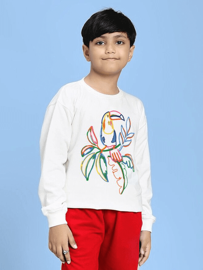 NATURE VIBES BIRD PRINT SWEATSHIRT FOR BOYS AND GIRLS WHITE with colorful bird illustration, worn by child in red pants.
