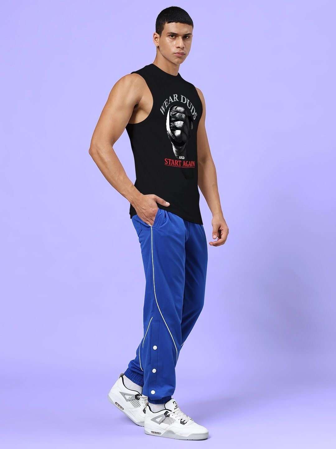 Athlete wearing NEVER QUIT START AGAIN GYM CO-ORD SET BLACK ROYAL BLUE for workout style and performance.
