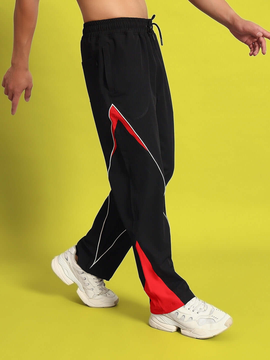 NISSAN black-red parachute cargo pants with customizable fit. Perfect for style and comfort.