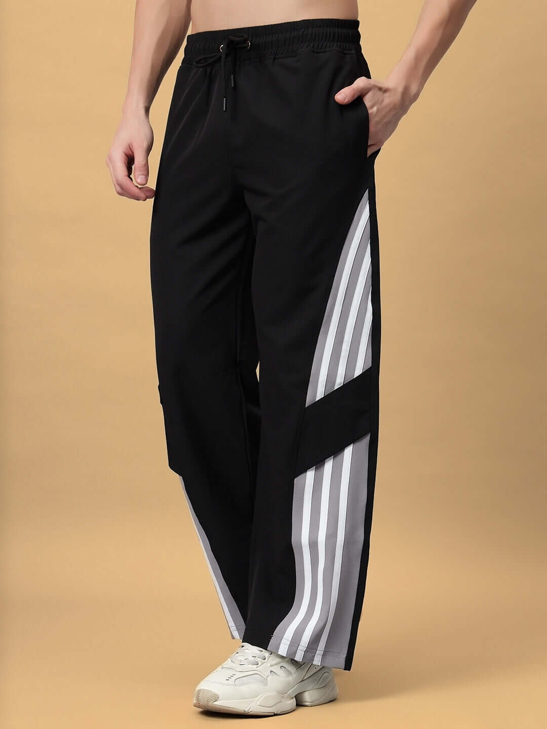 Black relaxed fit cargo pants with white striped design, featuring a custom size option for a personalized fit.