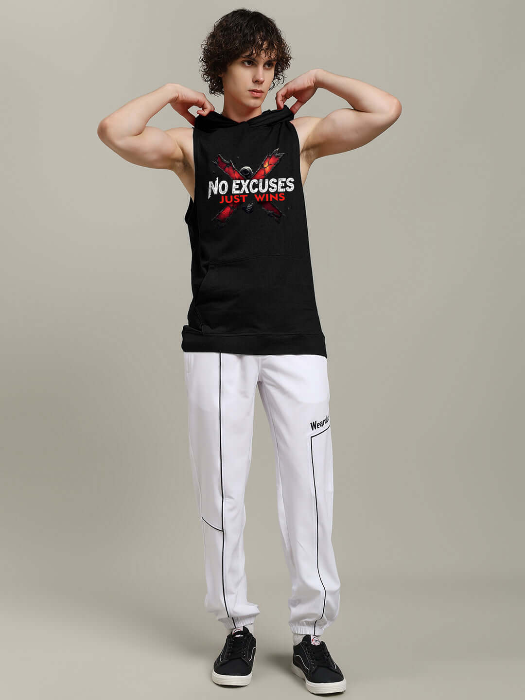 Black hooded gym T-shirt with 'NO EXCUSES JUST WINS' printed on the front, worn by a model. Perfect for workouts. Custom fit available.