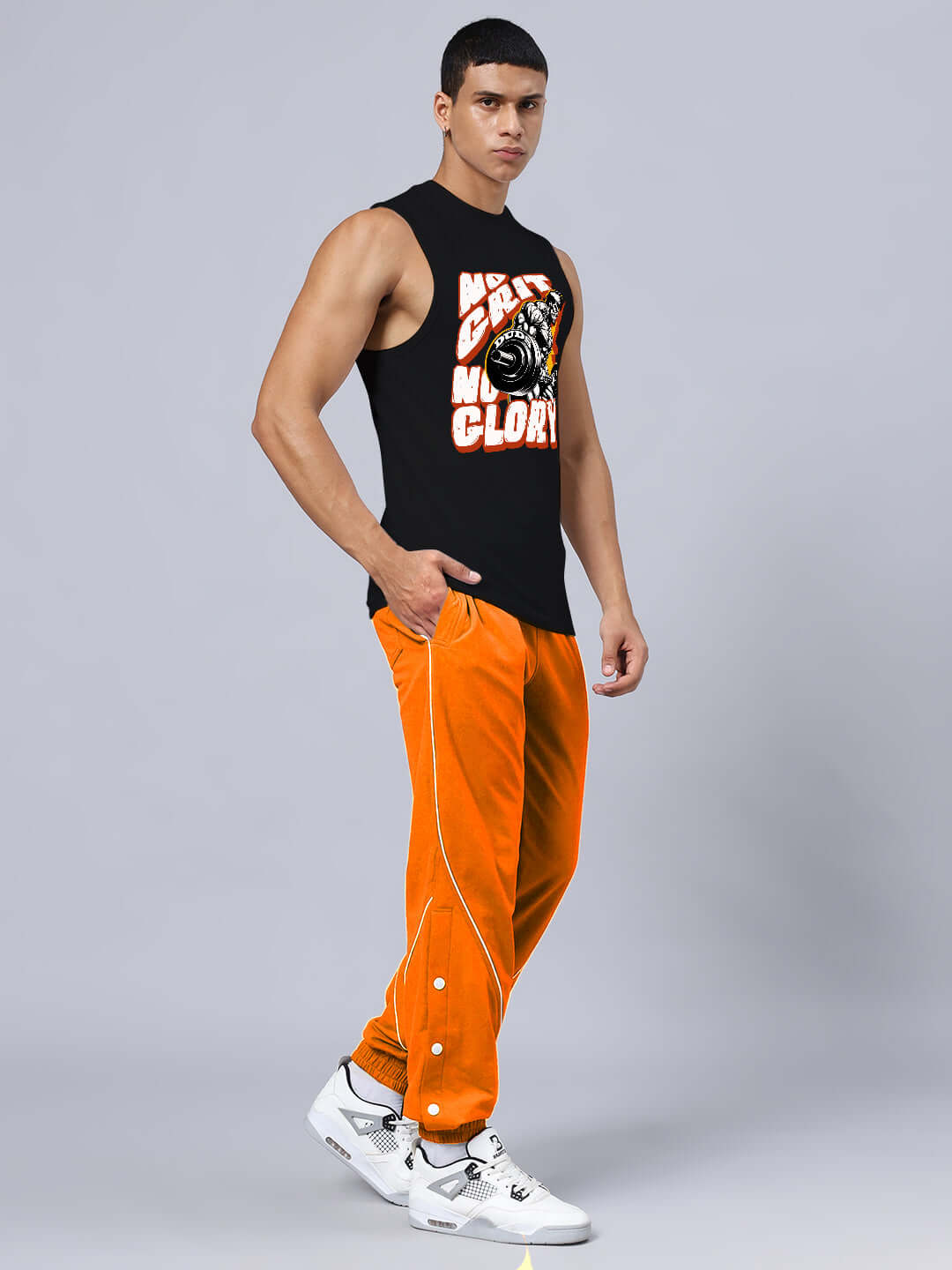 Man wearing NO GRIT NO GLORY GYM RELAXED FIT CO-ORD SET BLACK-ORANGE for intense workout session