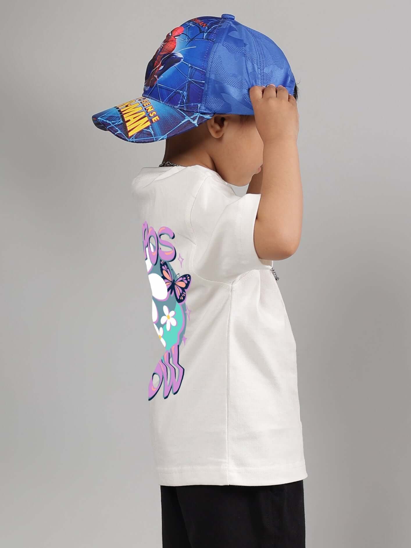 Child wearing off-white NO POS WOW t-shirt with colorful graphic, Spiderman cap, side view for boys & girls fashion.