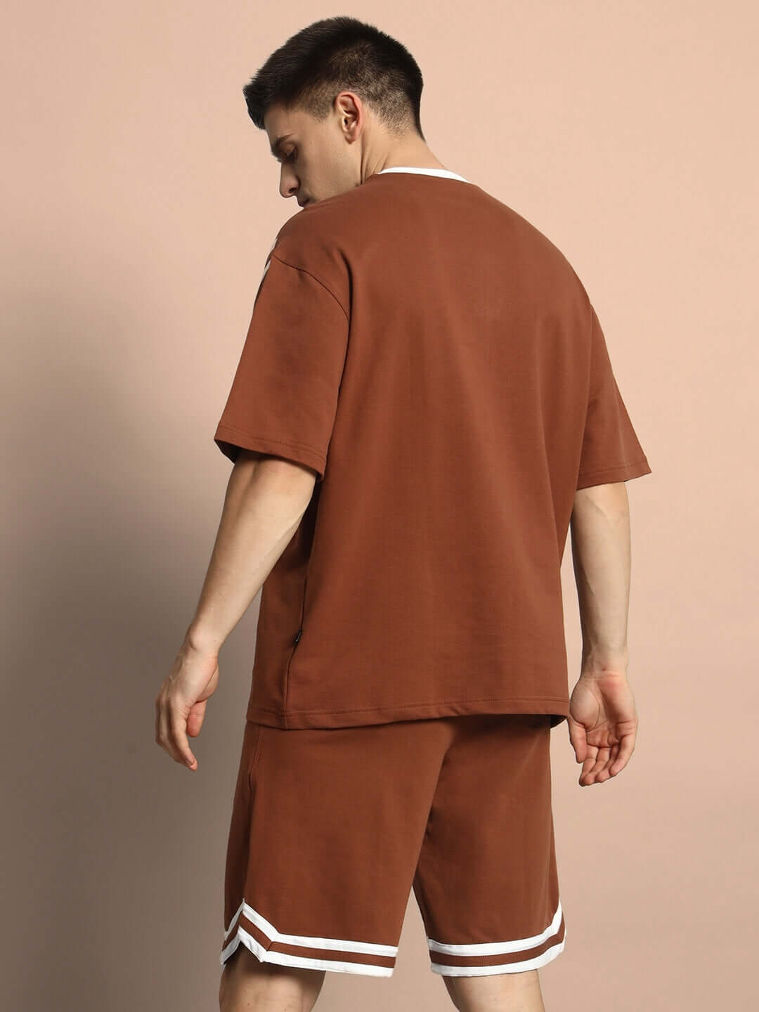 Model wearing Nordic Co-ord Set in brown, showcasing premium cotton French terry lycra, relaxed fit, perfect for casual wear.