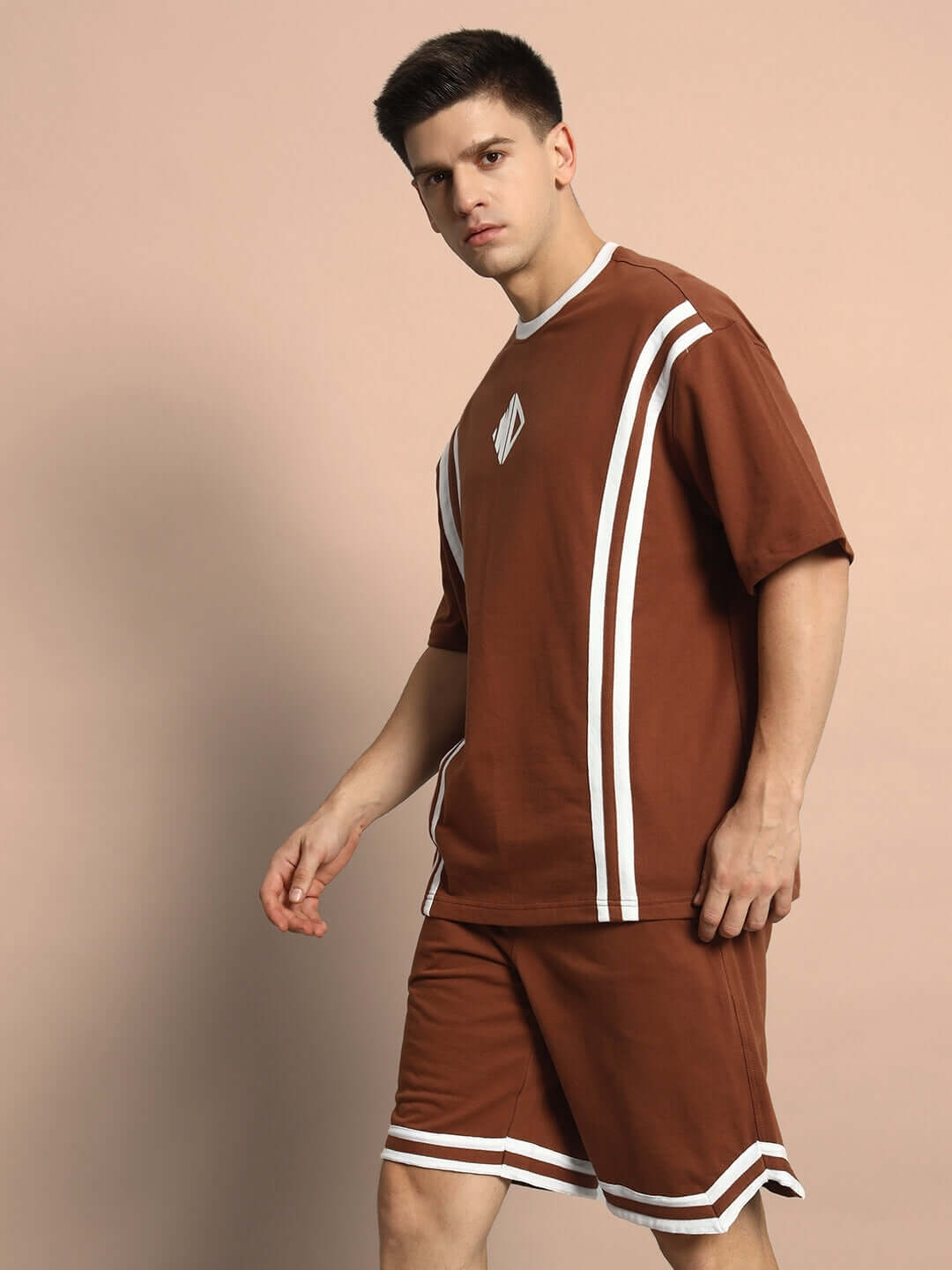 Model wearing Nordic Co-Ord Set in brown, featuring premium cotton fabric and stylish design with white stripe details, ideal for comfort.