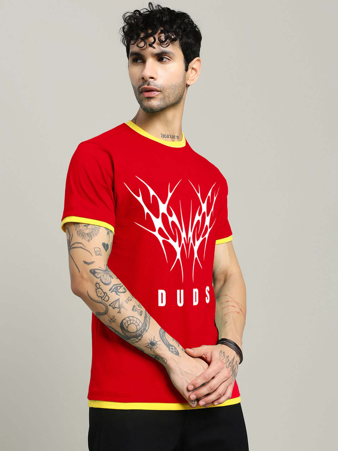 Model wearing NORIBA regular fit red t-shirt with graphic design, premium heavy gauge 100% cotton, bio-washed, made in India.