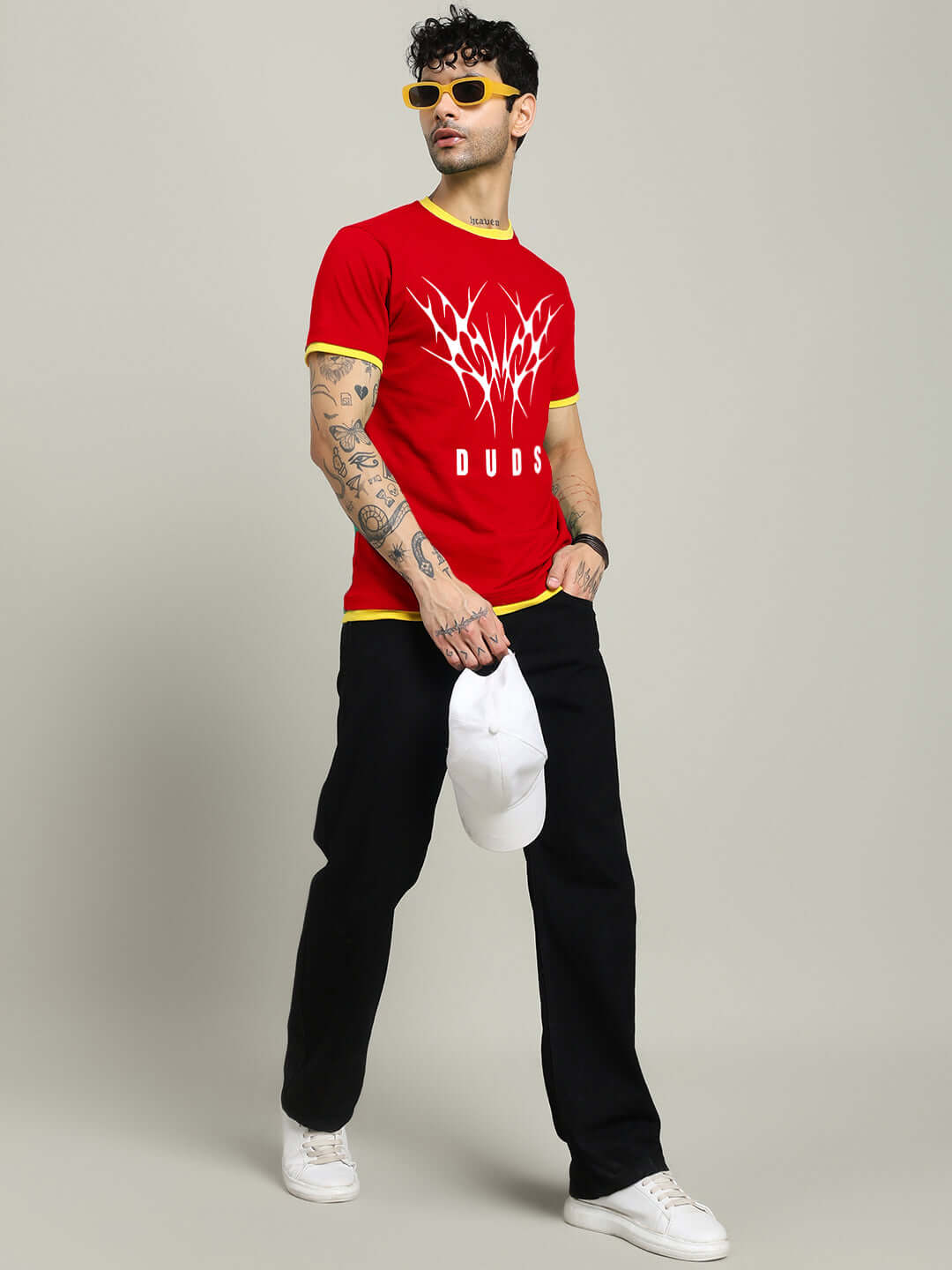 Model wearing NORIBA regular fit red T-shirt, 100% cotton, with graphic print, ideal for fashion-forward look.