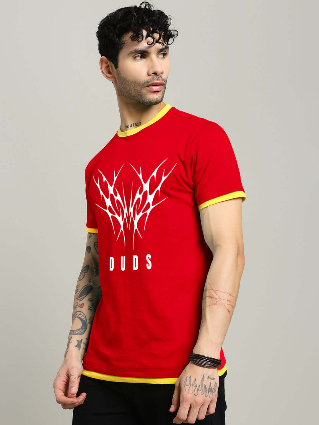 Man wearing NORIBA red regular fit t-shirt with artistic design, 100% cotton, bio-washed, premium fabric, manufactured in India.