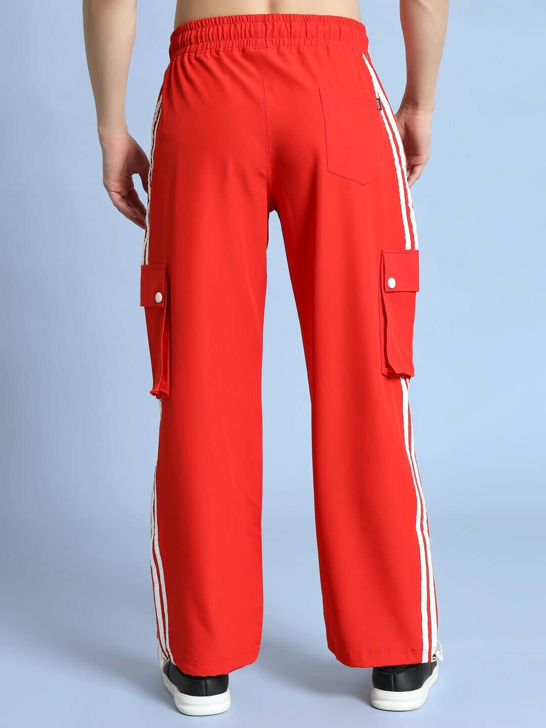 Back view of Nova Relaxed Fit Cargo Pants Red with cargo pockets and stripes.
