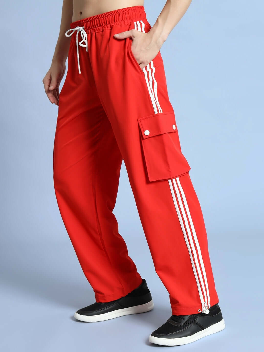 Red NOVA relaxed fit cargo pants with side stripes and pocket, showcasing custom fit option for personalized comfort.