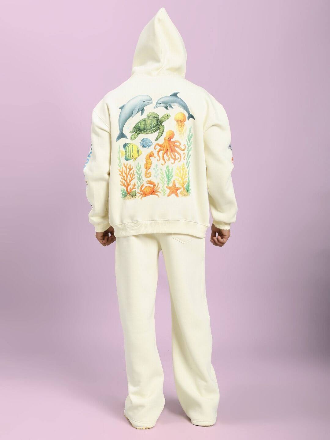 Back view of off-white OCEAN BUDDIES FLEECE CO-ORD SET showcasing sea-inspired graphics on hoodie.