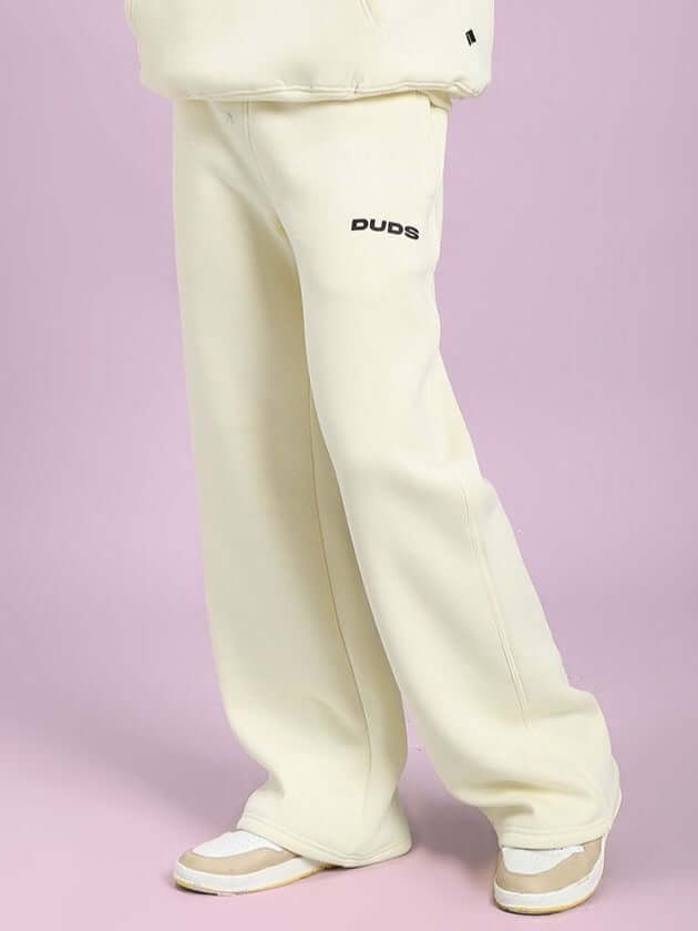 OCEAN BUDDIES JOGGER OFF-WHITE showcasing relaxed fit, playful style, crafted for comfort with unique sea life graphic.