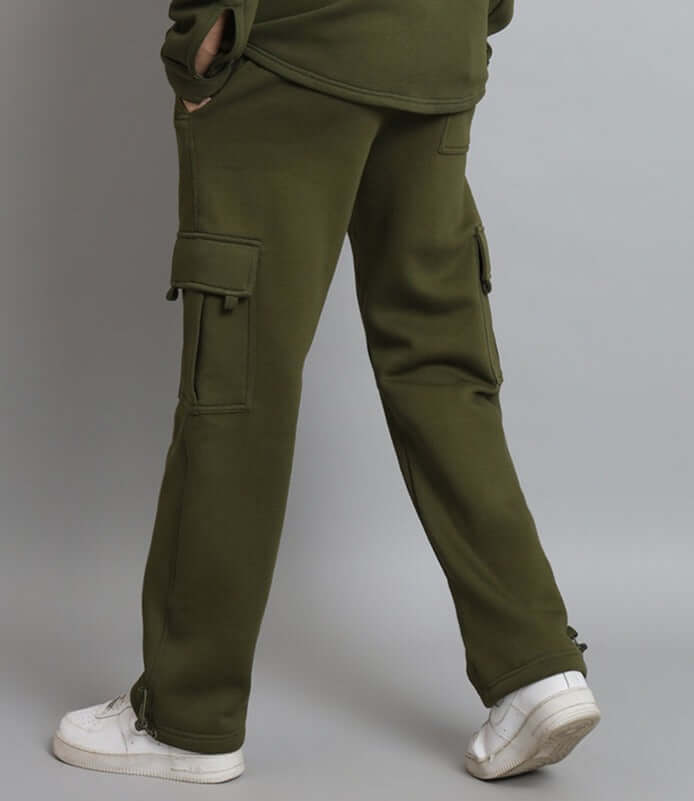 Olive green relaxed fit fleece cargo pant with side pockets, ideal for comfort and style, paired with white sneakers.