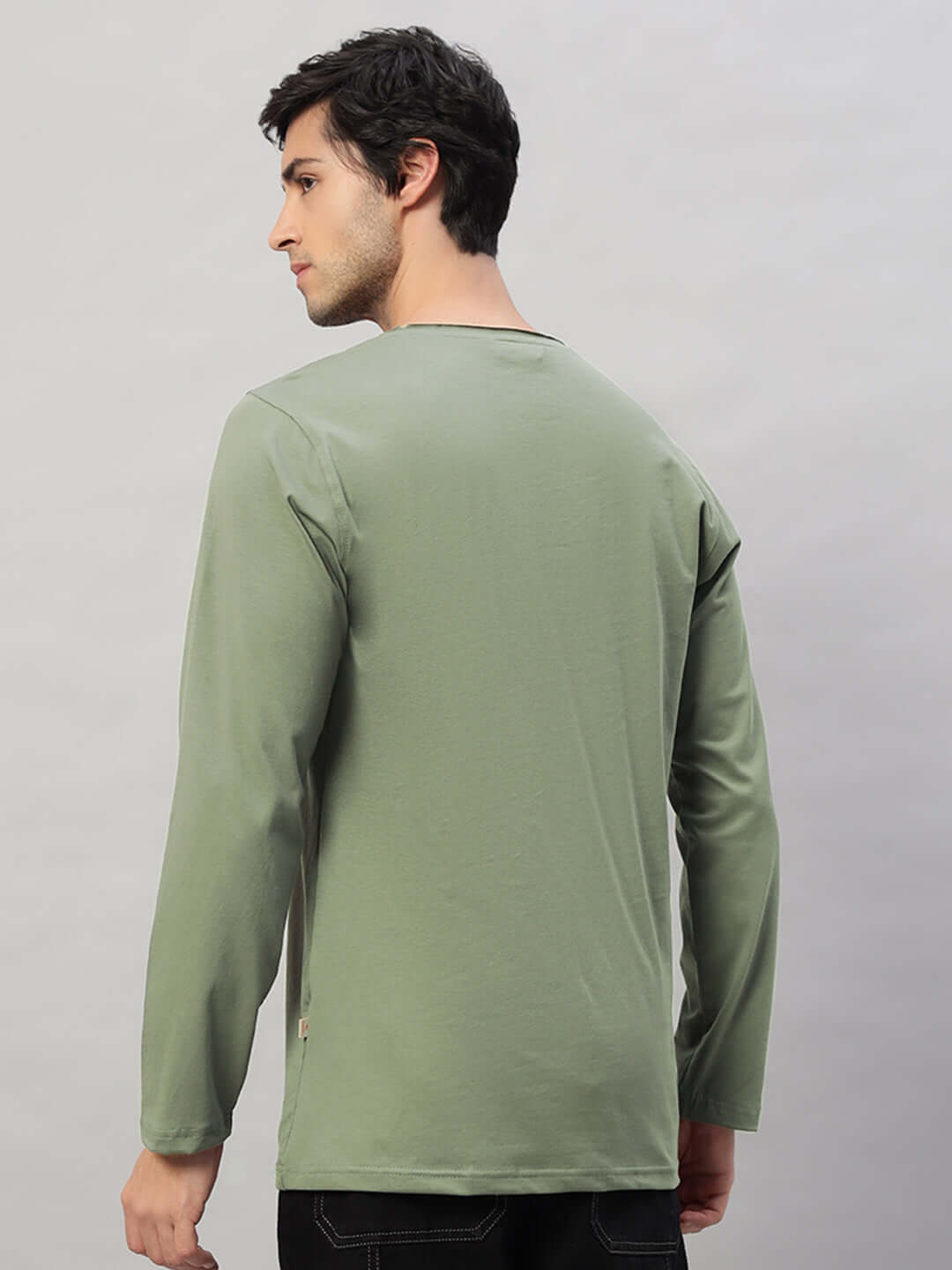 Rear view of a man wearing a sage green OMNI slim fit sweatshirt made from premium 100% cotton fabric. Designed for comfort and style.