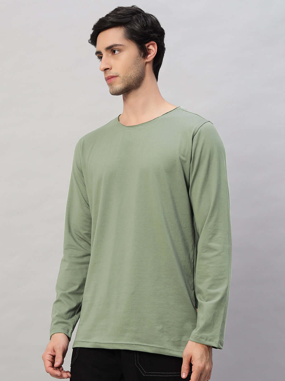 Model wearing OMNI Slim Fit Sweatshirt in Sage Green, made from 100% cotton premium heavy gauge fabric, long-sleeved design.